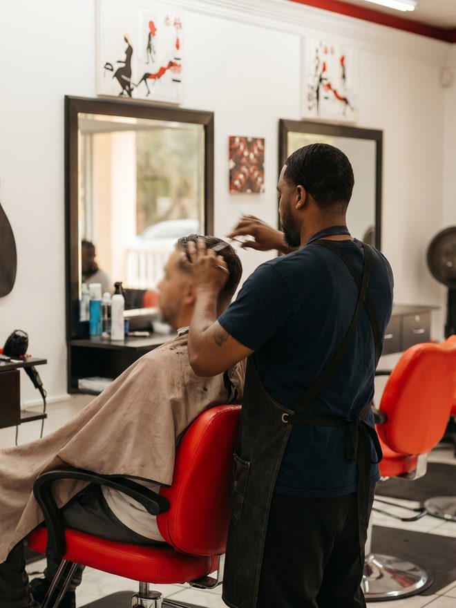 Barber at work, skin fade in progress, Naples FL