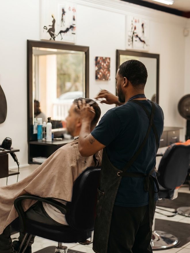 Barber at work, skin fade in progress, Naples FL